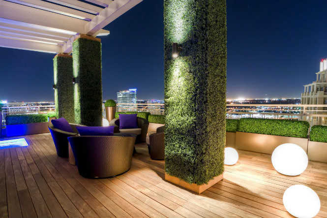 10 Amazing ideas on how to use floorlamps in rooftops Living columns covered in dense greenery give this modern outdoor space a natural touc